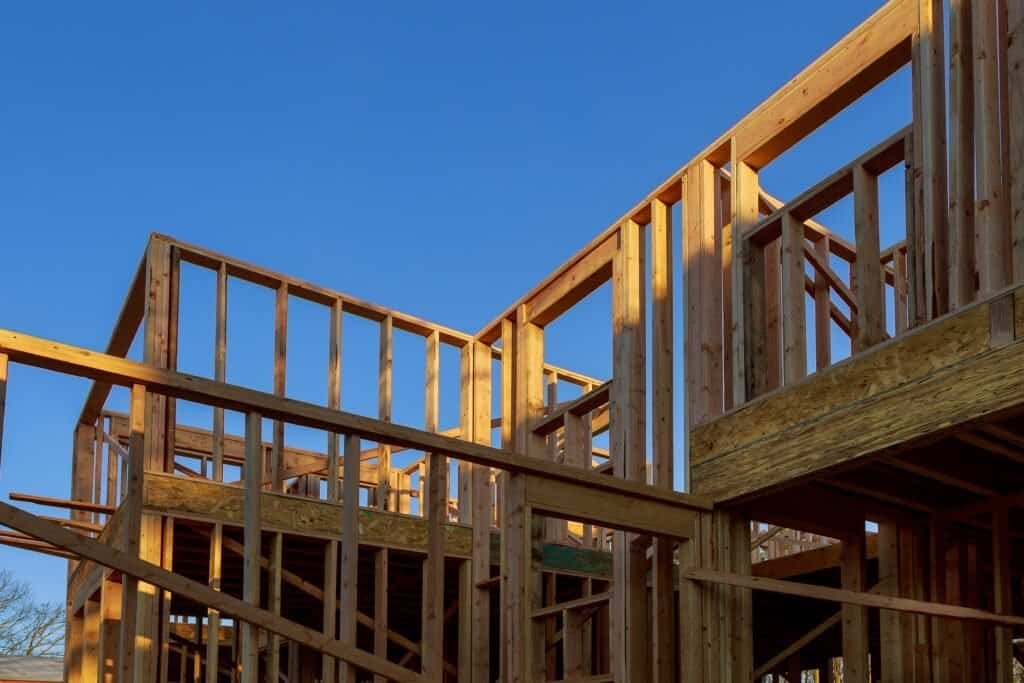 Wooden building framework under construction by Bestyle Construction Inc.
