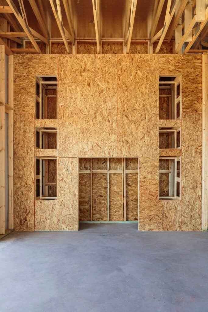 Wooden framing and OSB wall panels in a new building under construction.